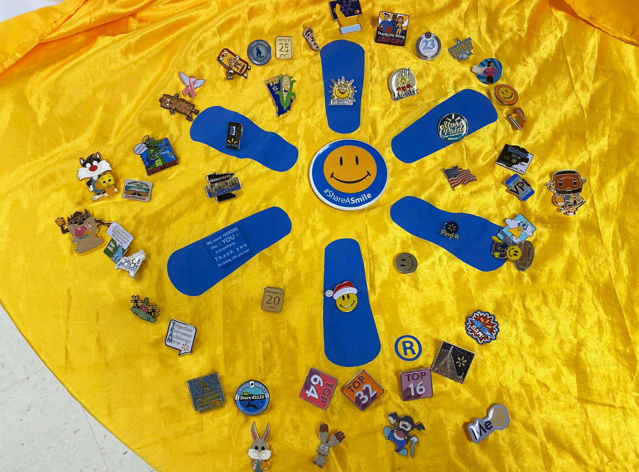 Eleanor Barnett decorated a yellow Walmart cape with multiple pins