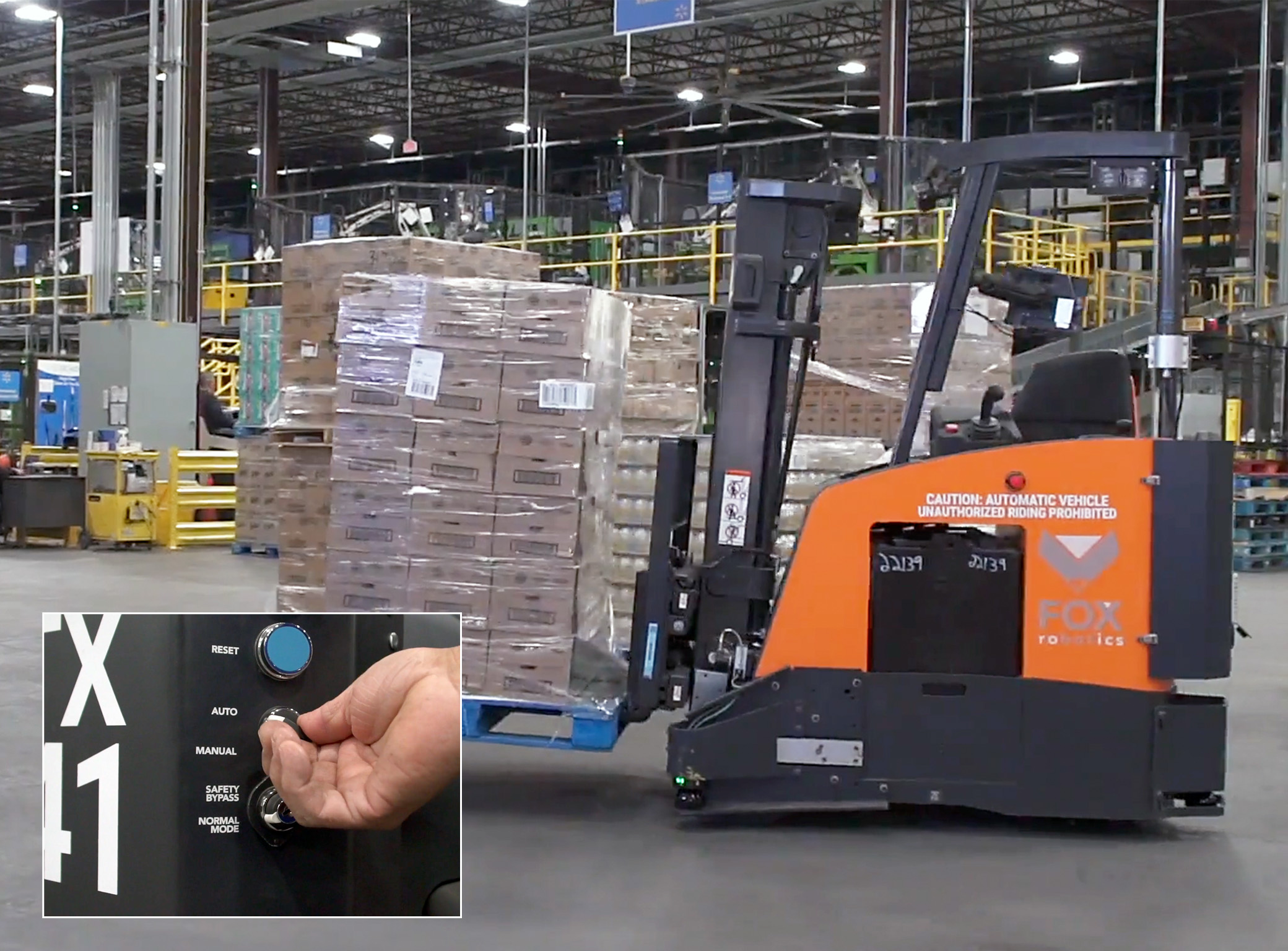 forklift machines at a distribution center surrounded by boxes