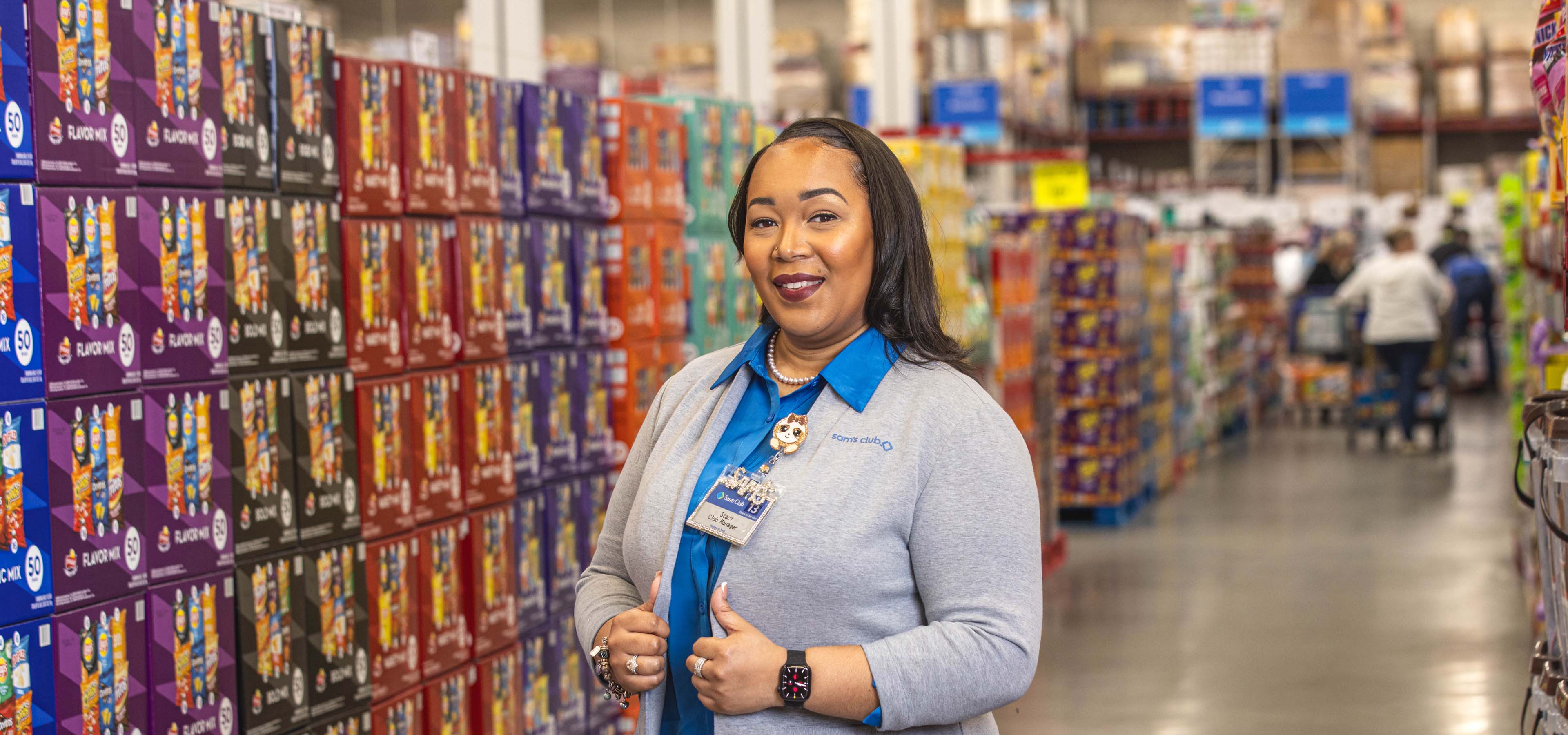 Female associate in the chip aisle of a Sam's Club