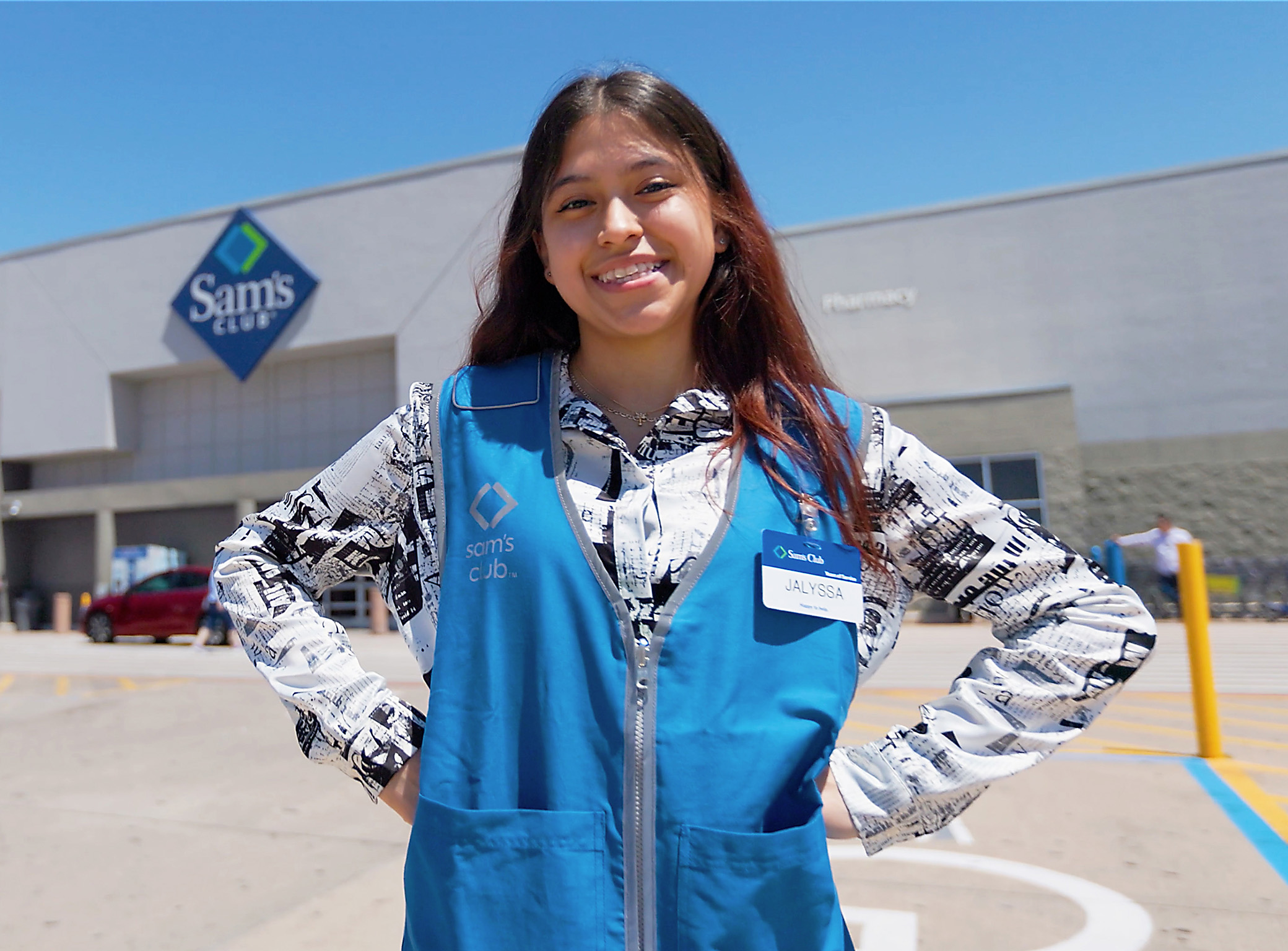 alyssa smiles in the sun outside the Sam’s Club where she works in the Dallas, Texas, area.