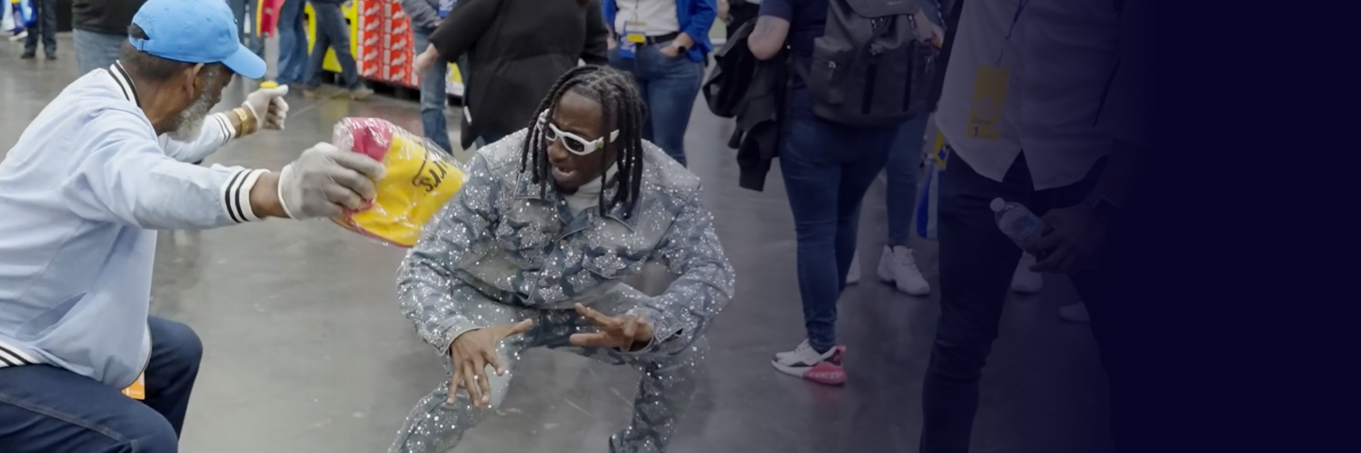 Viral sensation Swisher3X dances with a Walmart associate.
