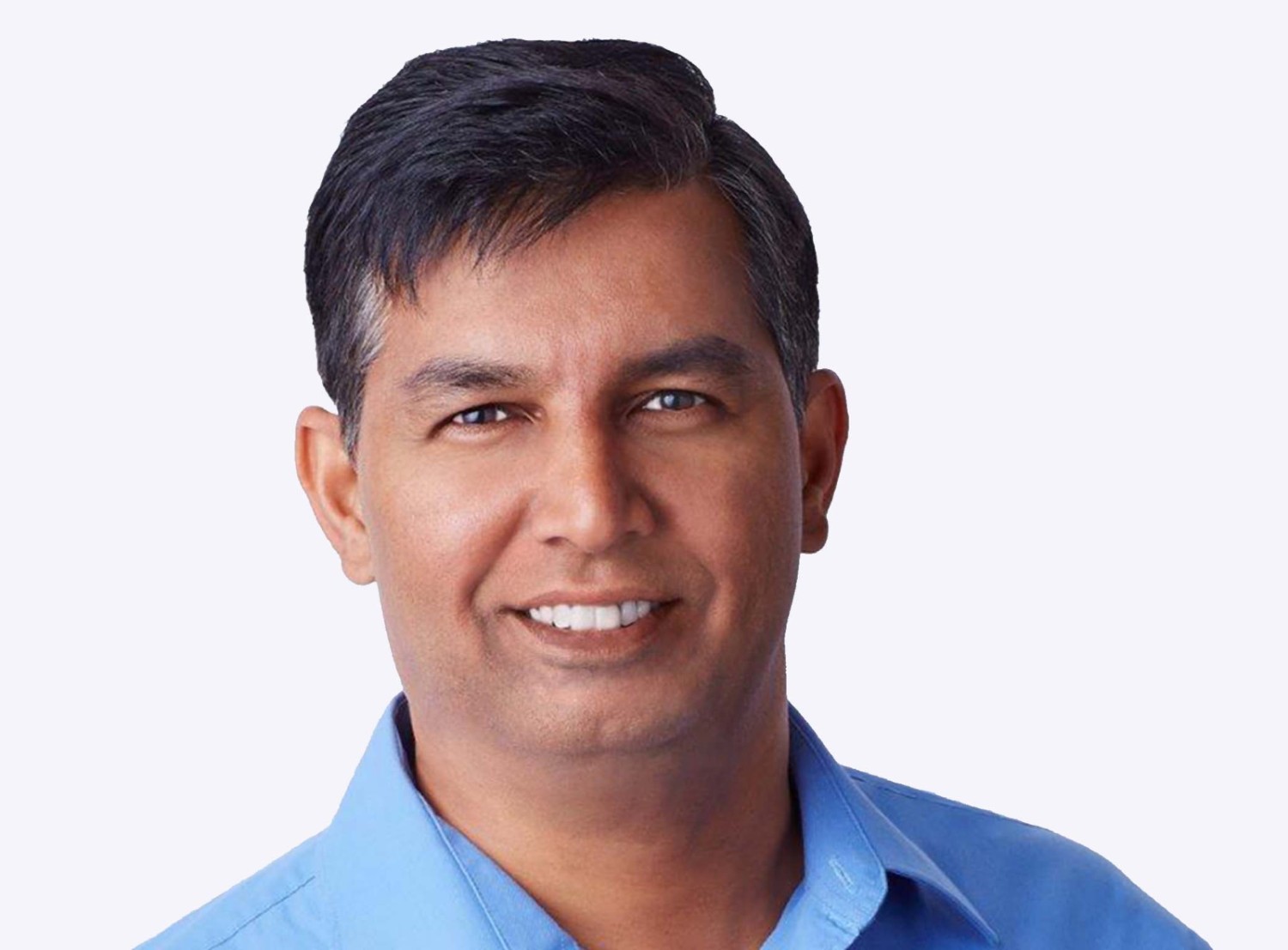 Srini Venkatesan smiles to the camera