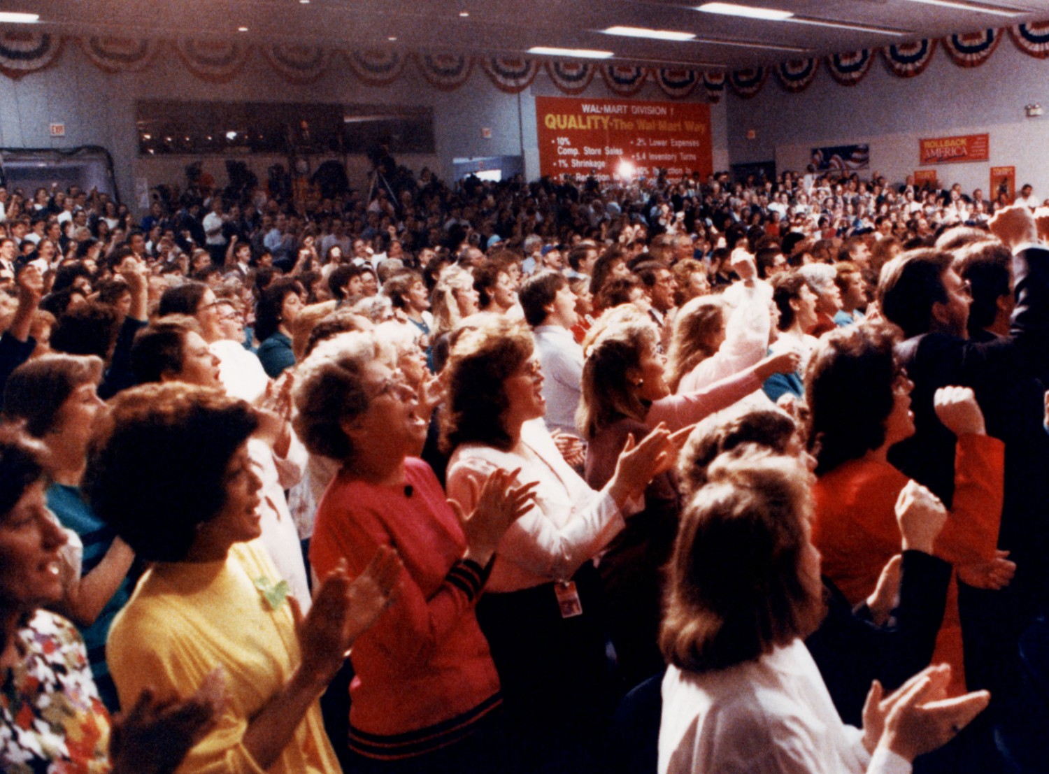 Walmart associates cheer for Sam Walton receiving the Presidential Medal of Honor.