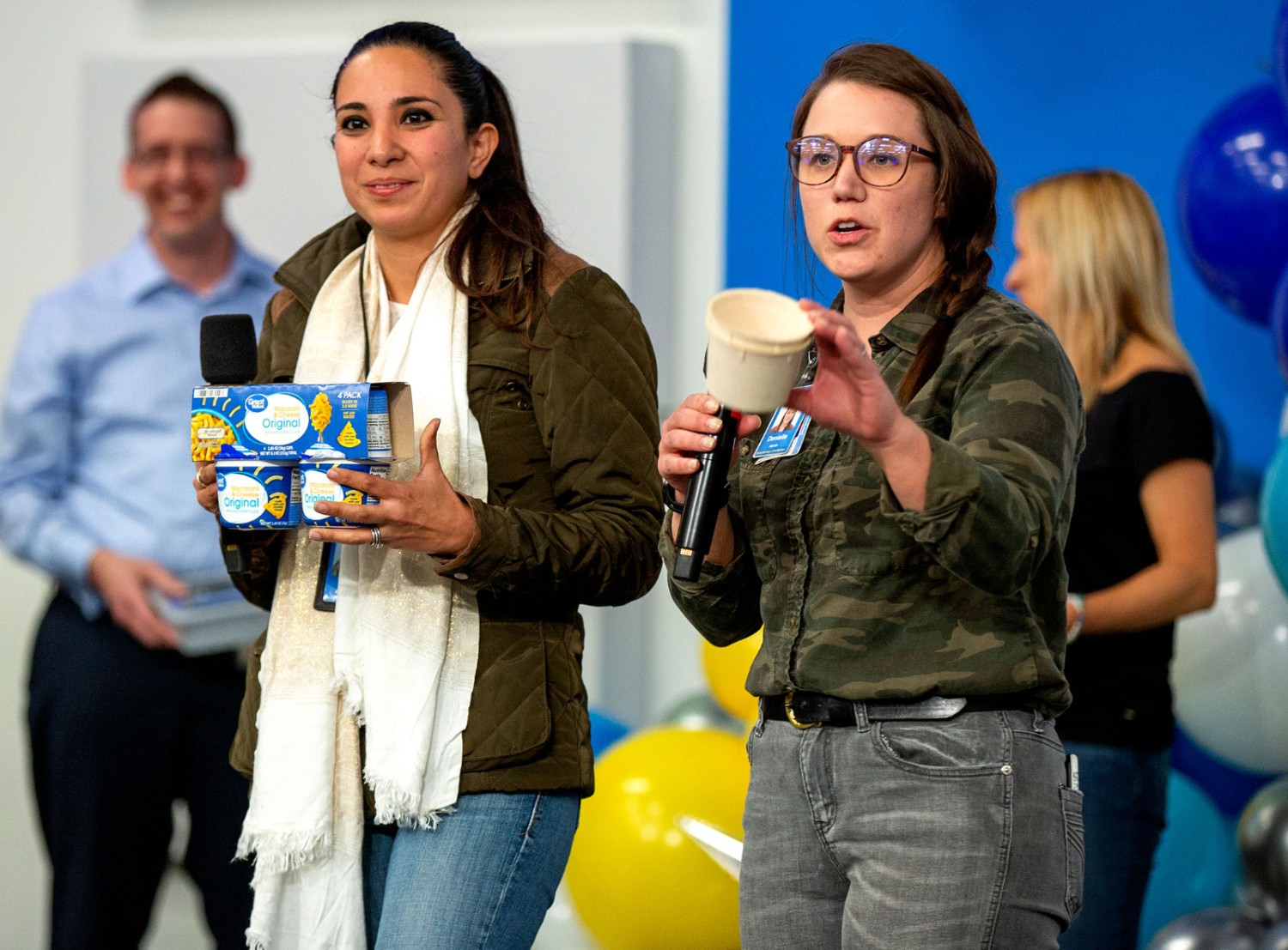 Danielle Harris displays new macaroni and cheese packaging that reduces waste.