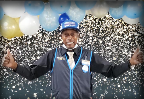 Marshall Johnson poses at a celebration for his 50 years of service.