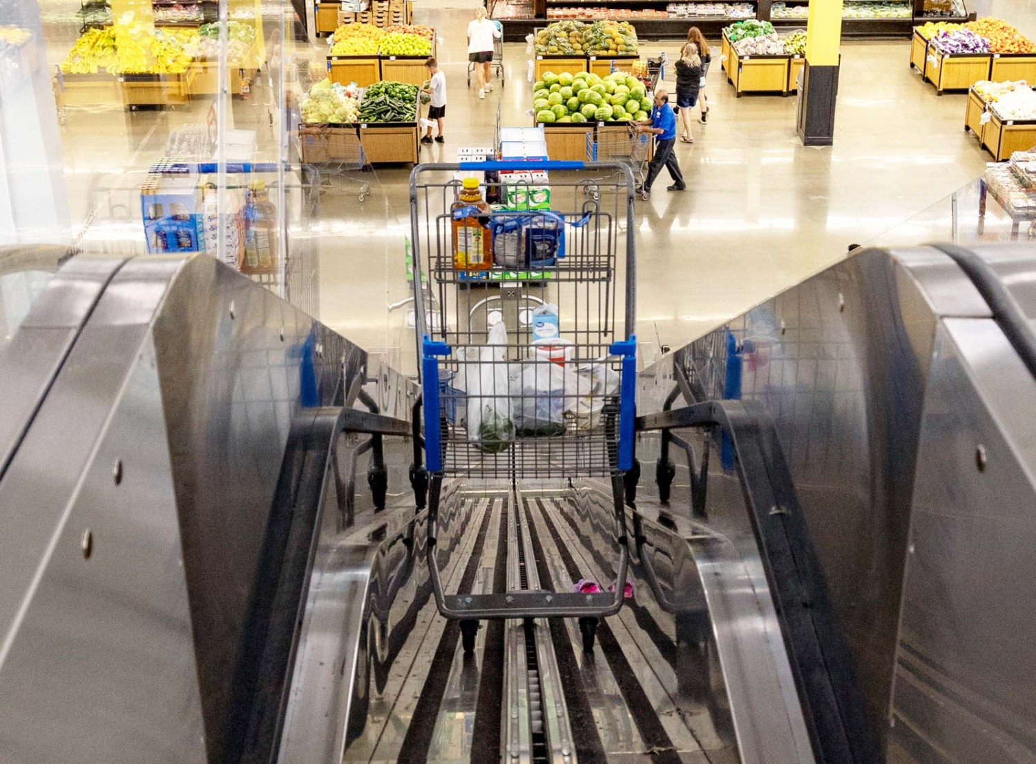 A shopping cart takes a ride on Store 2152's 'cartalator.'