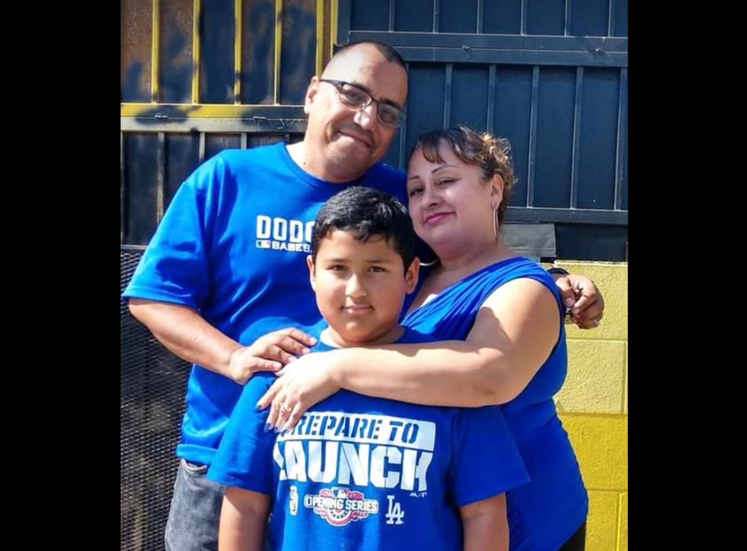 Alfonso Guerrero poses with his wife and son.