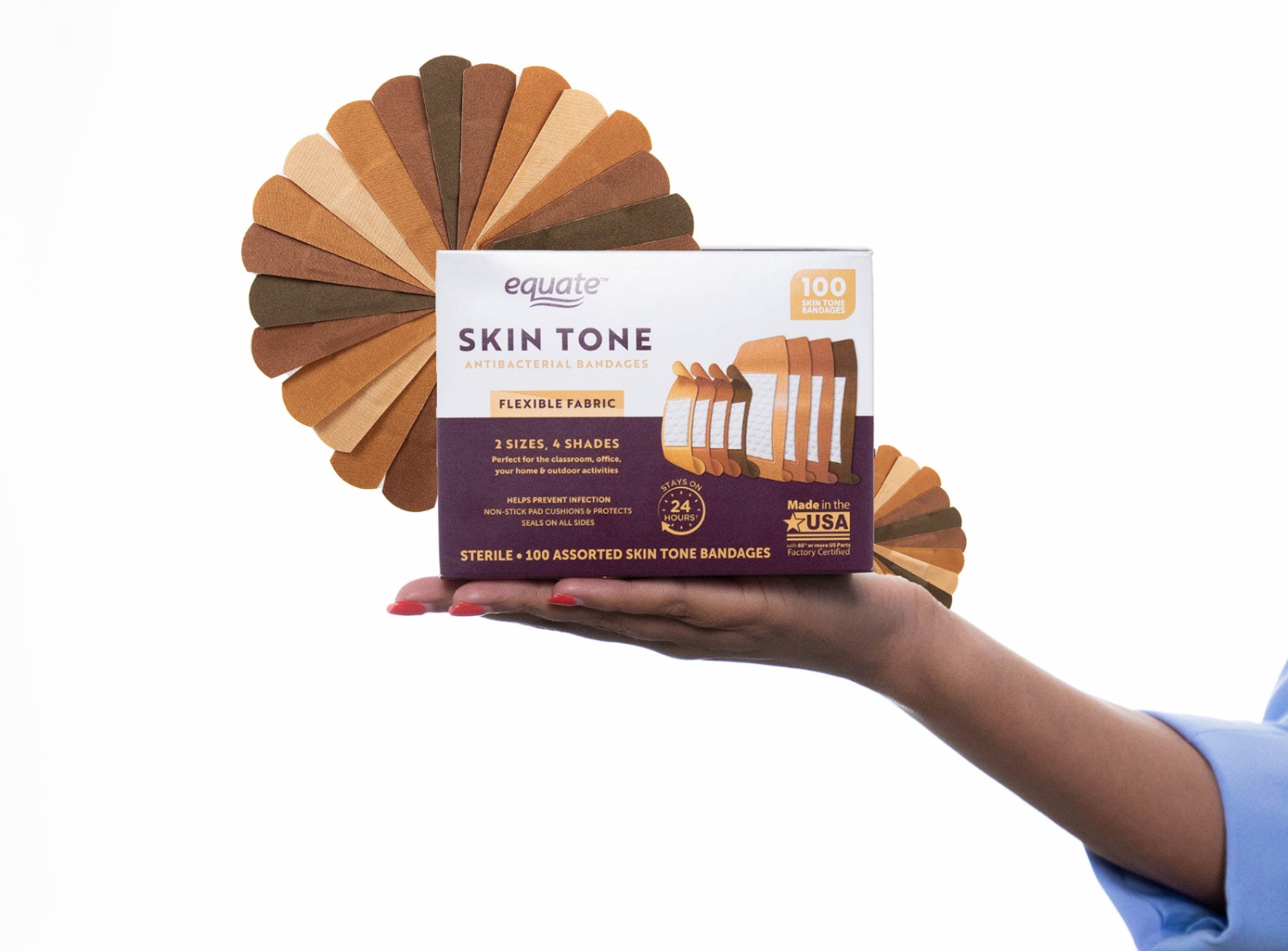 photo of a woman holding a box of skin tone bandages