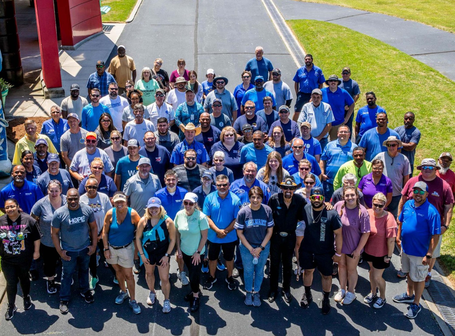 big group of associates smiling in a group picture