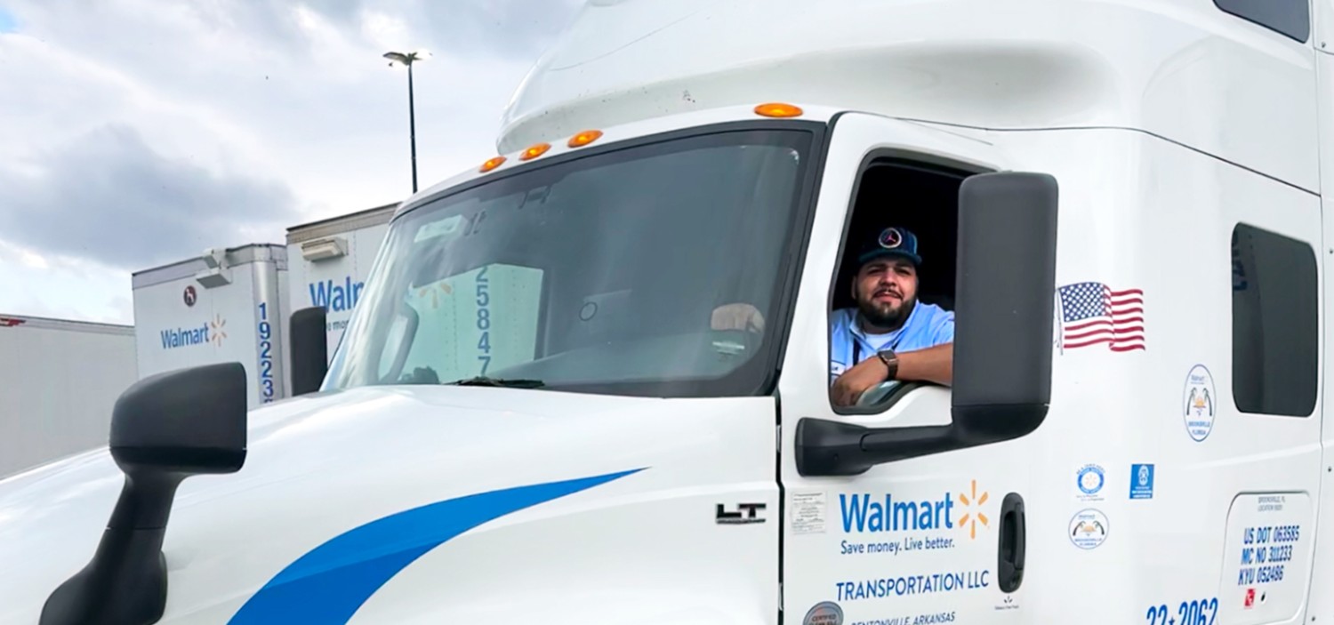 Erick in the drivers seat of a Walmart truck