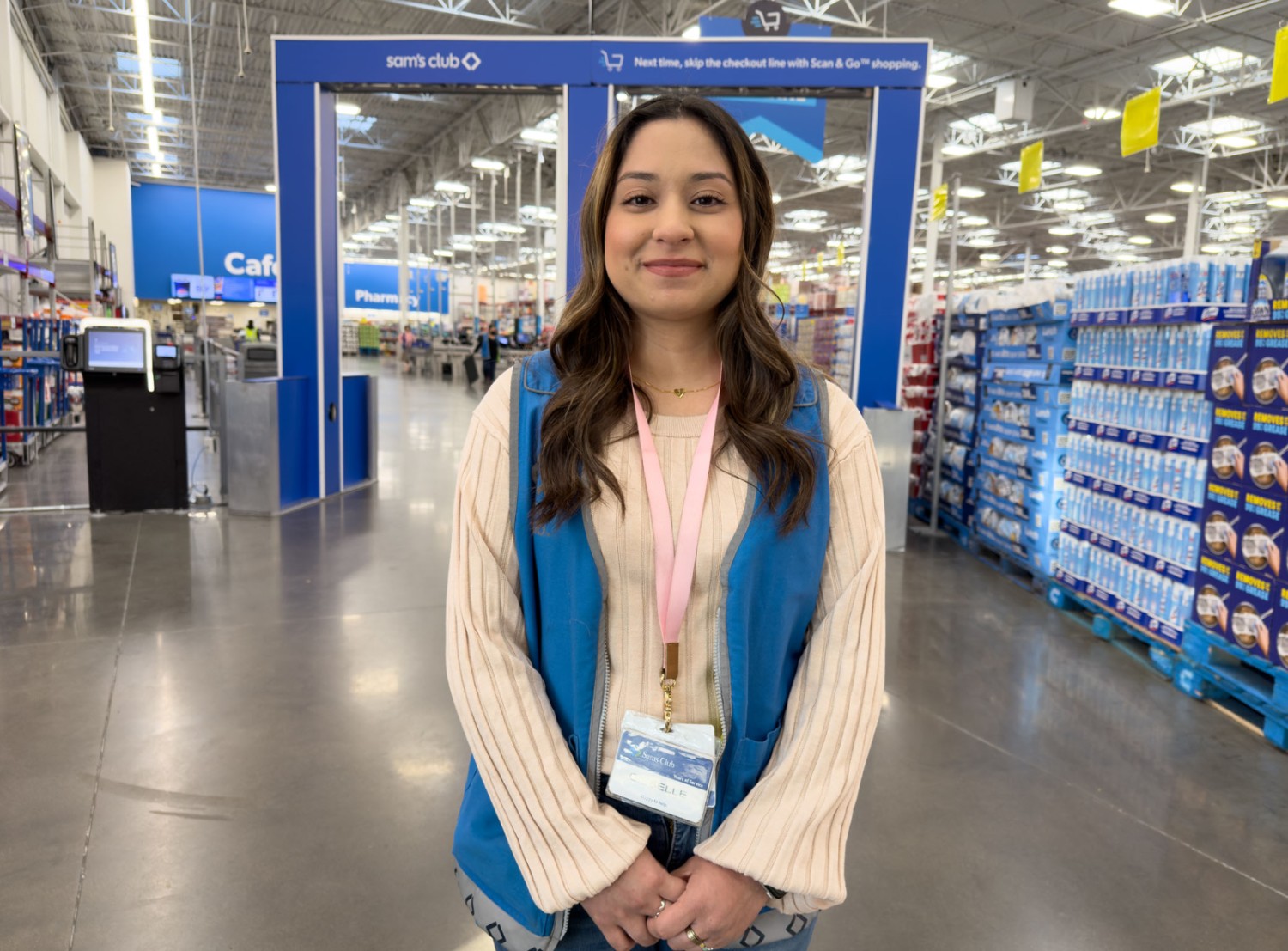 Gabby smiling at the camera at the front of a Sam's club