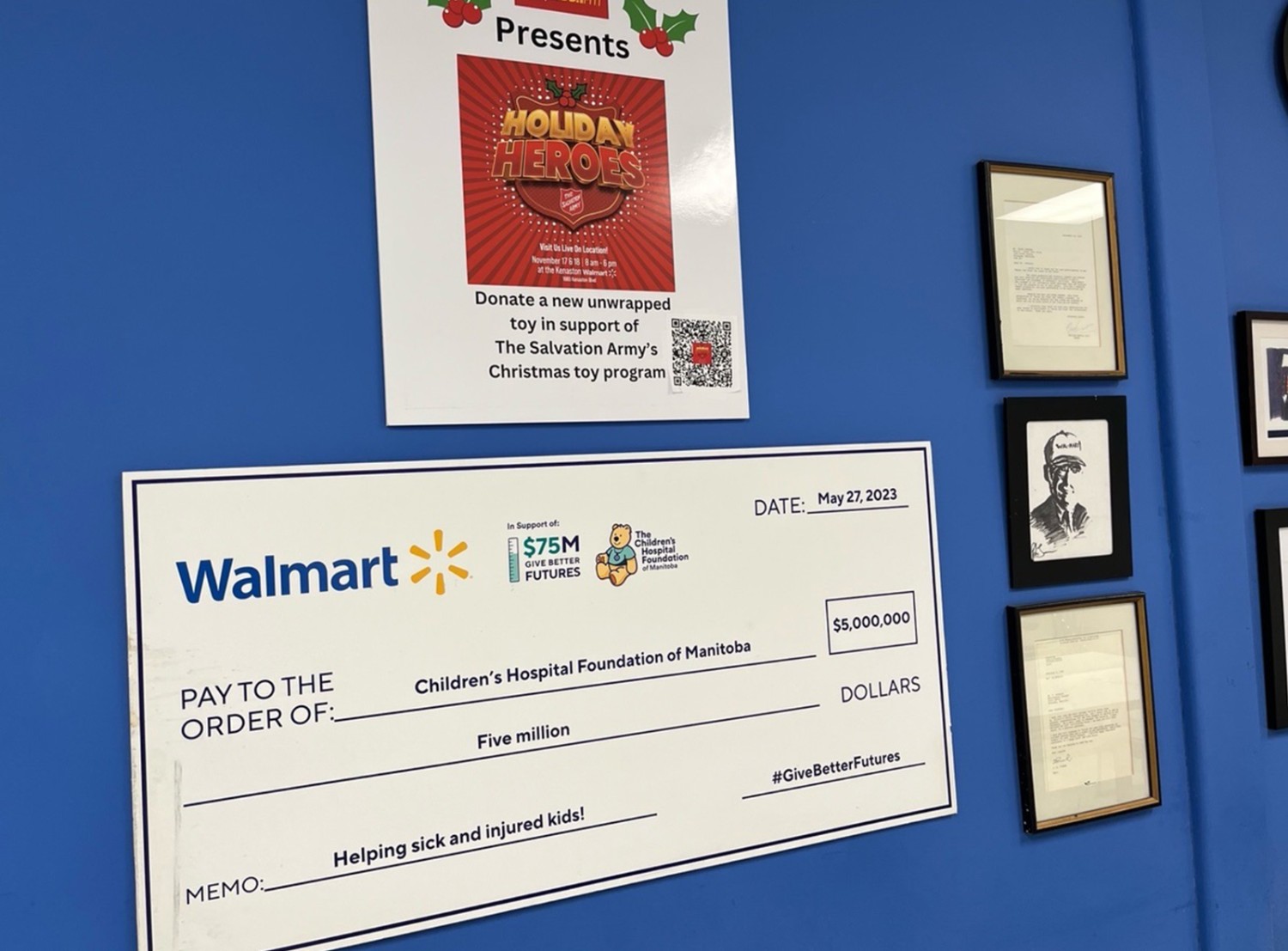 A Walmart charity check hanging on a wall