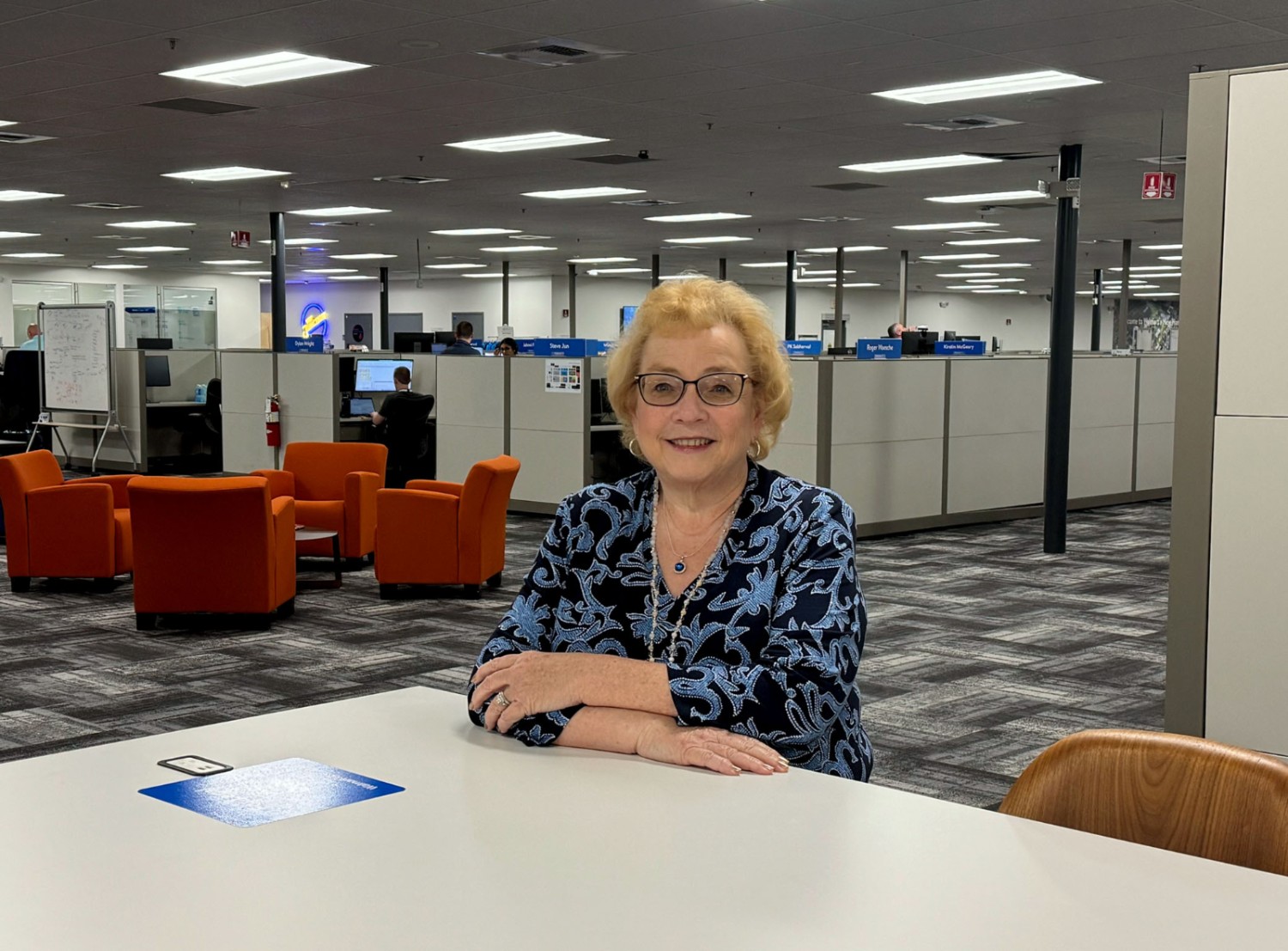 Teresa Stewart sitting at a desk of an office