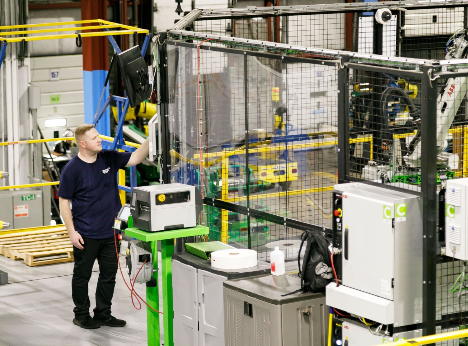 Chance on the floor of an RDC touching an automation screen