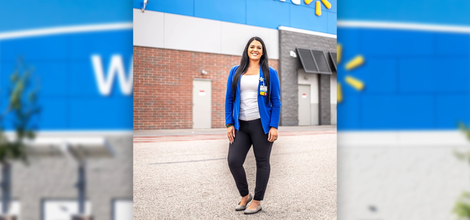 Oriana Fantasia posing in front of a Walmart Supercenter store front