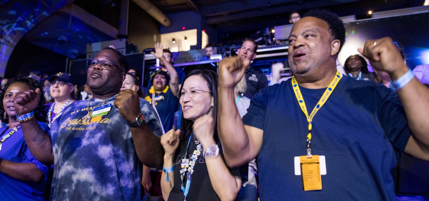 a crowd of sam's club associates cheering