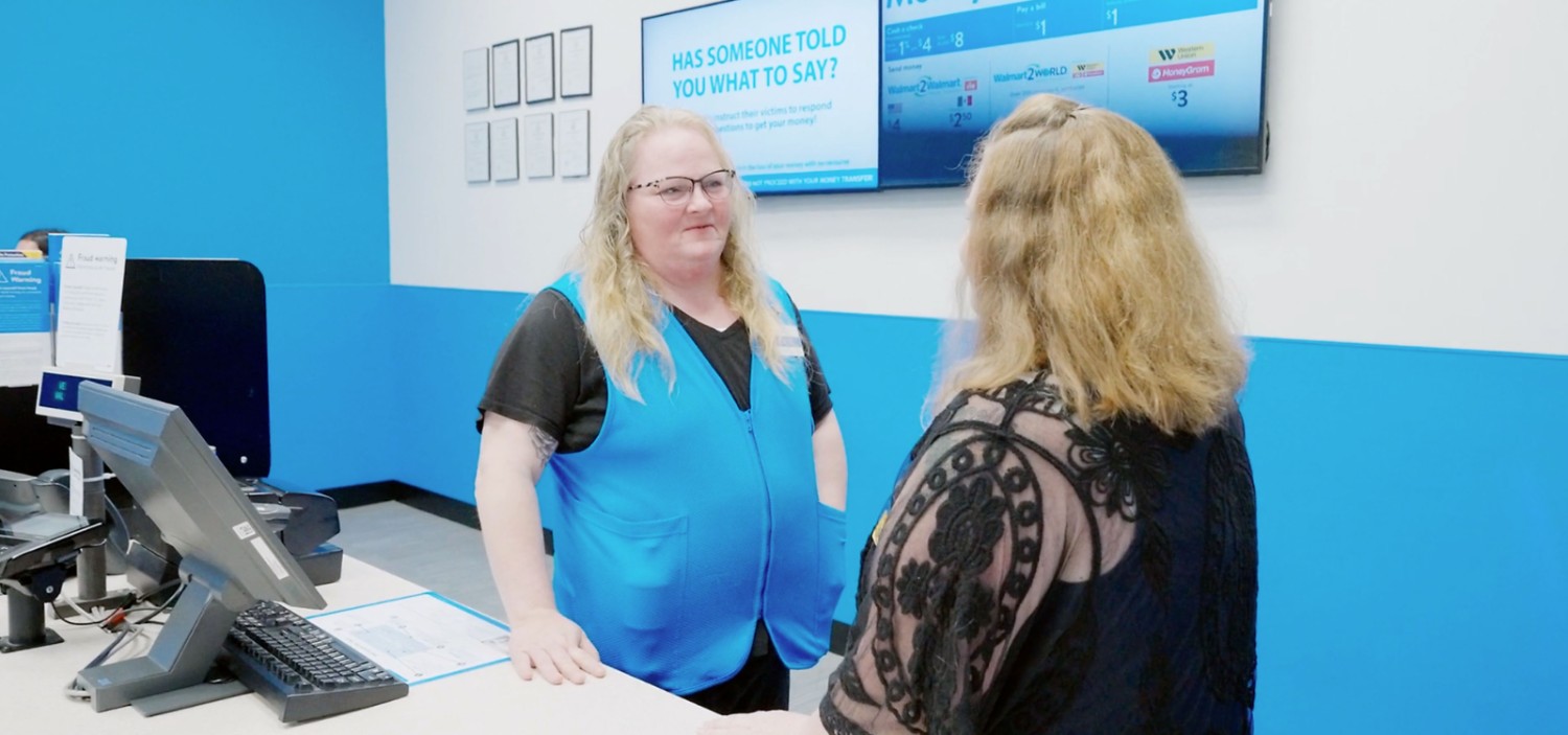 Teresa and female associate facing each other talking