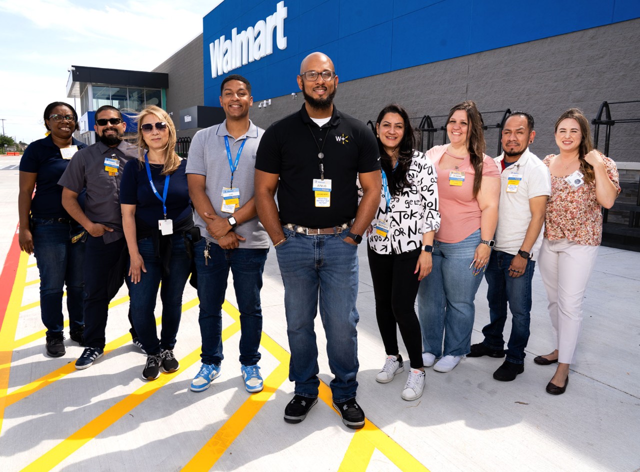 Store Manager Junius Williams stands with some of his team at Walmart’s new Supercenter in Cypress, Texas.